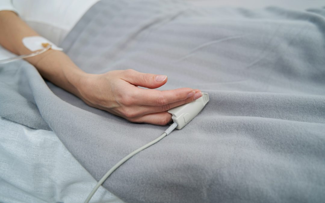 Female patient lying in hospital bed during intravenous therapy